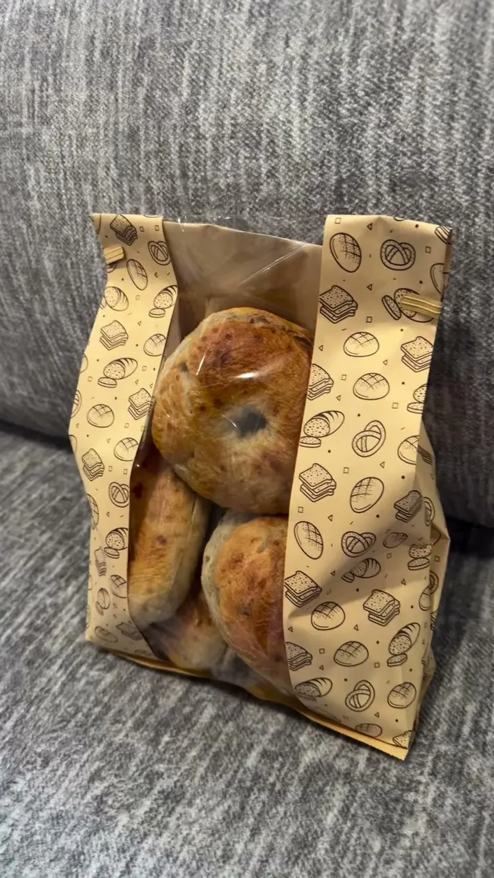Bagels in a printed paper bag