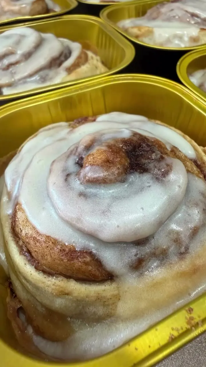 A glazed sourdough cinnamon roll close up